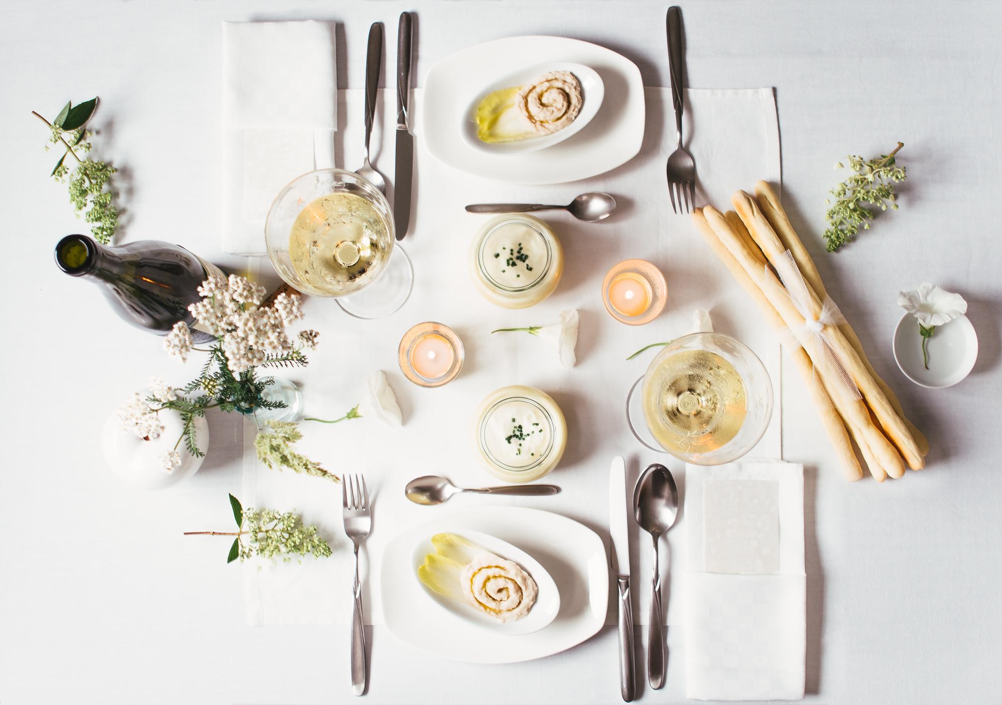 Long table set for an intimate tasting with candles